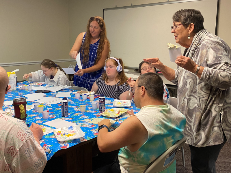 Melanie O’Dowd of Sunshine Ambassadors and artist Bobbye Edwards conducting an art class at Spark